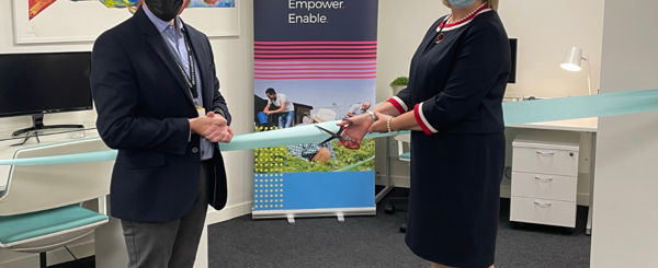 James Sanderson and Prof Dame Helen Stokes Lampard cut a blue ribbon with scissors to mark the opening of NASP's office at the Southbank Centre in London.