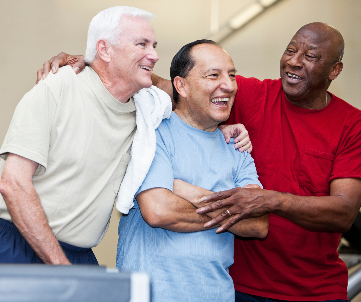 Three men talking and smiling