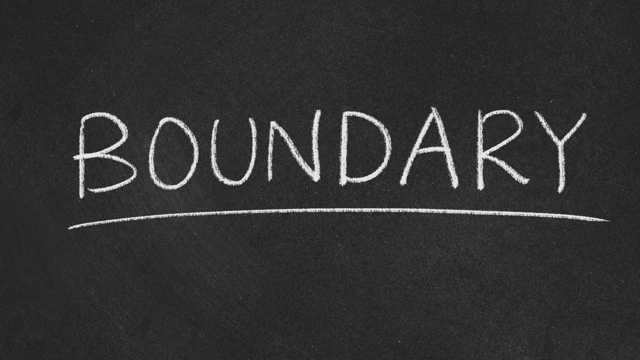 A graphical image of a blackboard with the word ‘Boundary’ written in chalk