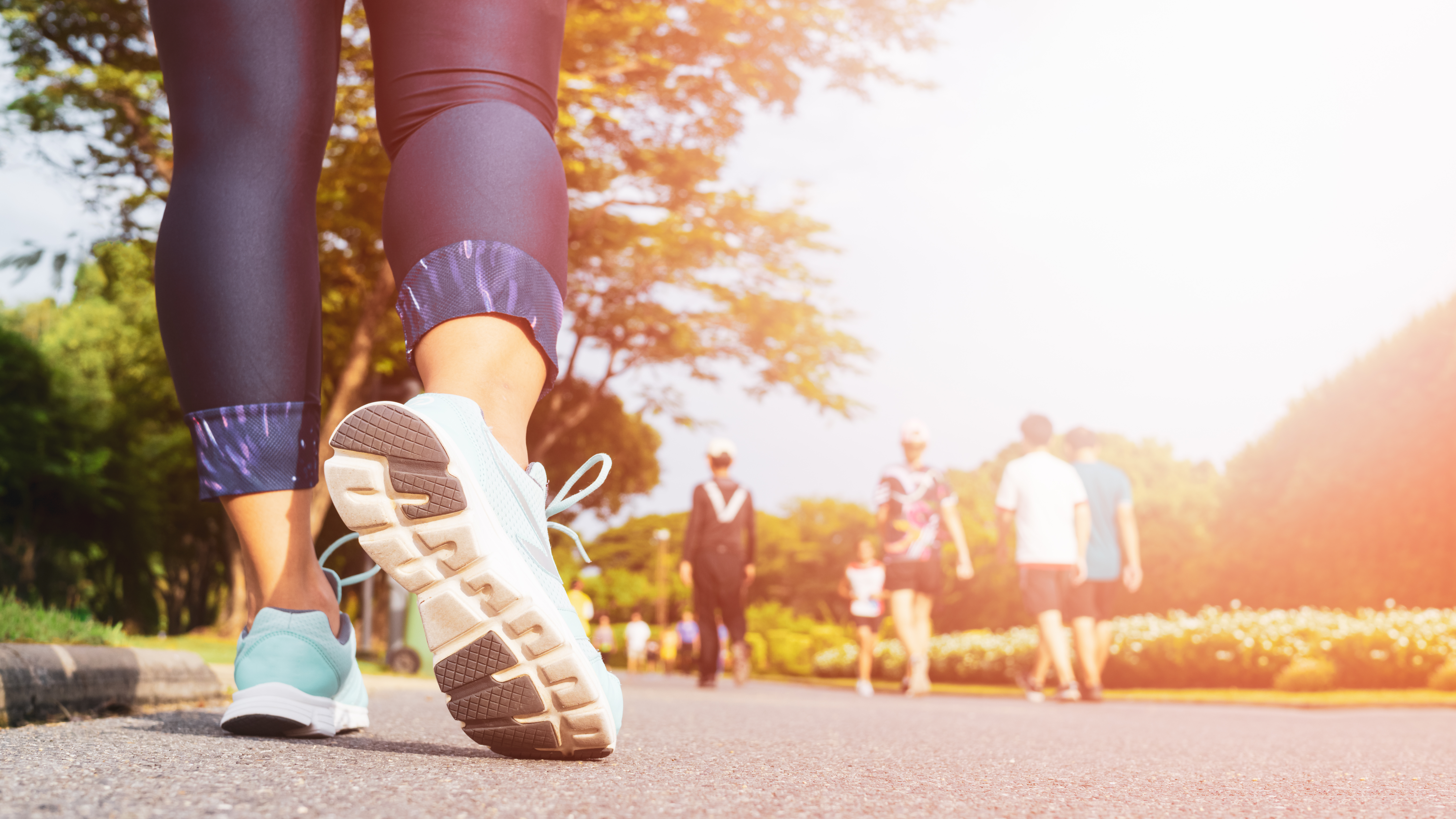 A closeup of a woman running in the park