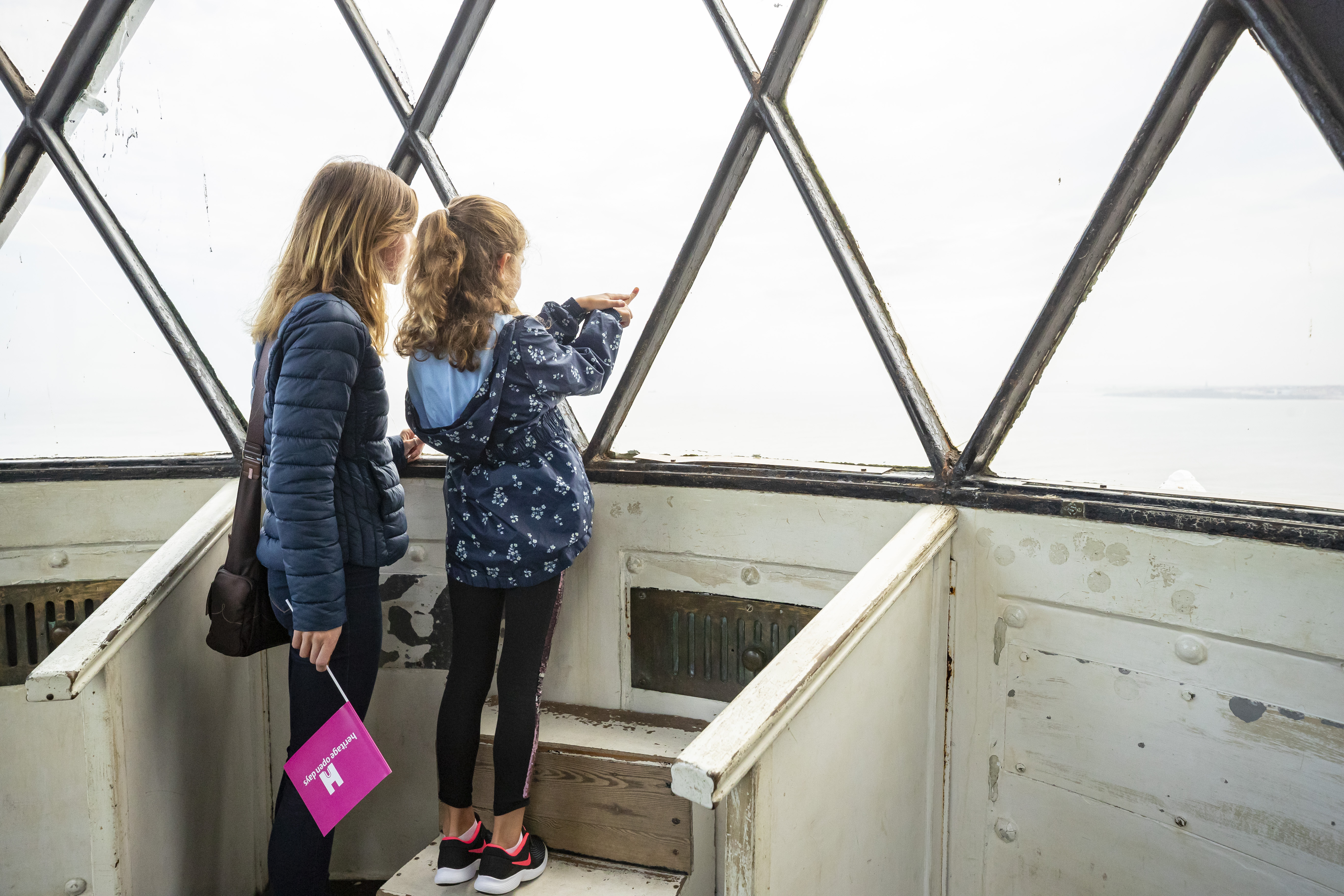 Mother and daughter visiting a lighthouse 