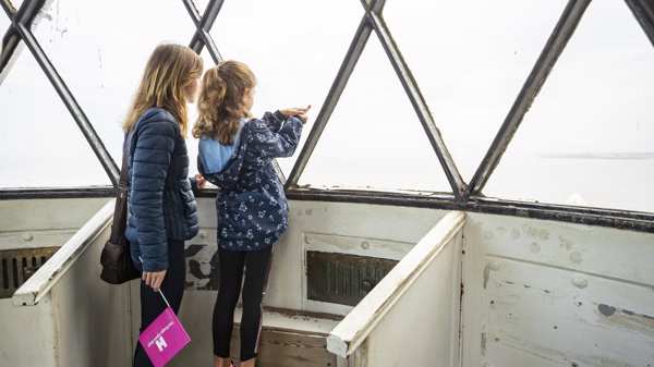 Mother and daughter visiting a lighthouse 