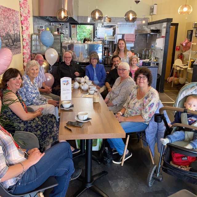 A group of people of different generations meet up at a Friends for You in a café in Chorley