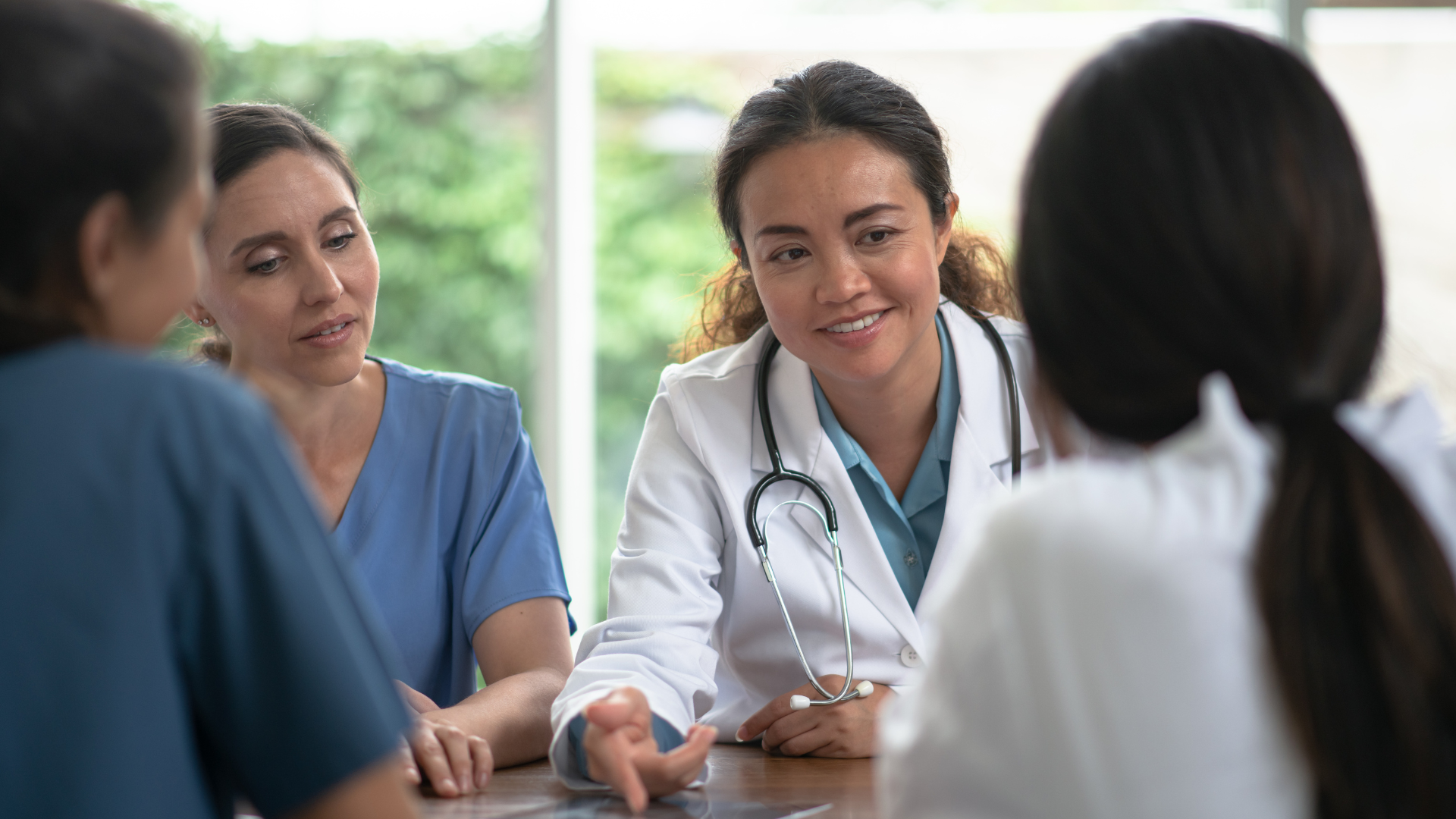 Image of doctors sitting together and chatting 