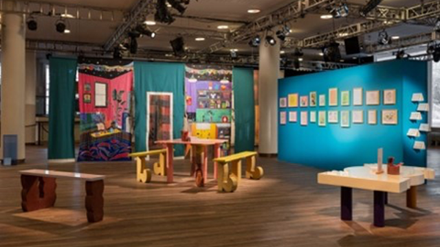 Framed and hanging art works on two colourful walls at the Southbank Centre in London