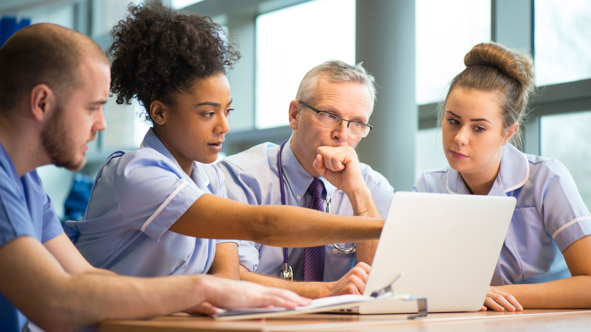 Doctors and nurses collaborating together 