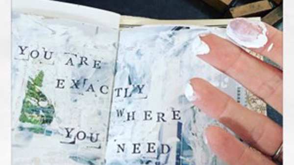 A handmade collage booklet with the phrase 'you are exactly where you need to be'