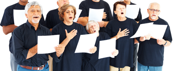 A group of older people sing together while reading music sheets